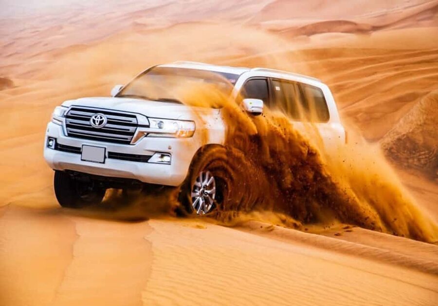 Dubai: Desert Safari, Camel Ride, Quad Bike & BBQ Dinner - Pickup begins with a 4x4 ride